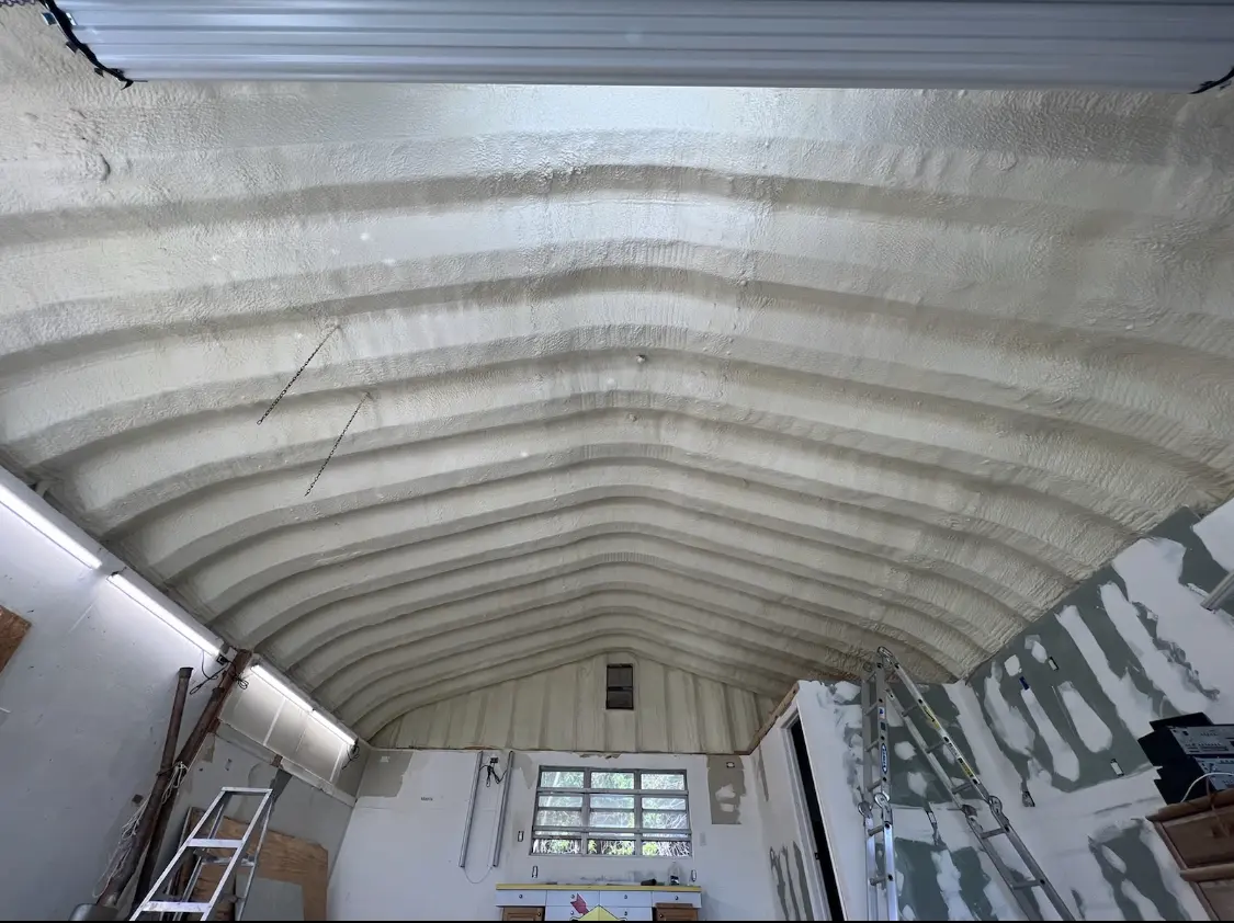 Spray polyurethane foam applied to the underside of a metal roof deck in Nuevo